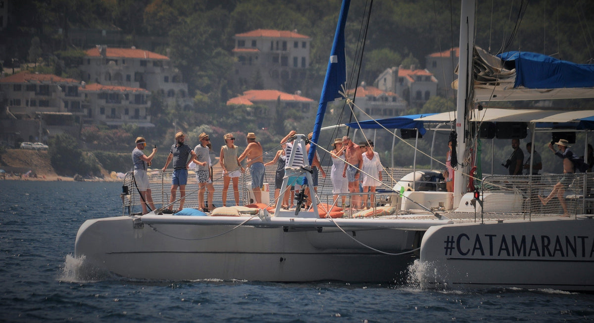A catamaran sailing in the Bay of Kotor near Perast, Montenegro